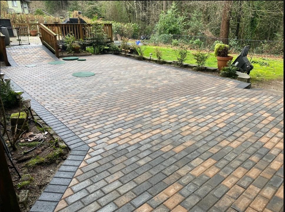 Professional paver patio installation in a residential backyard