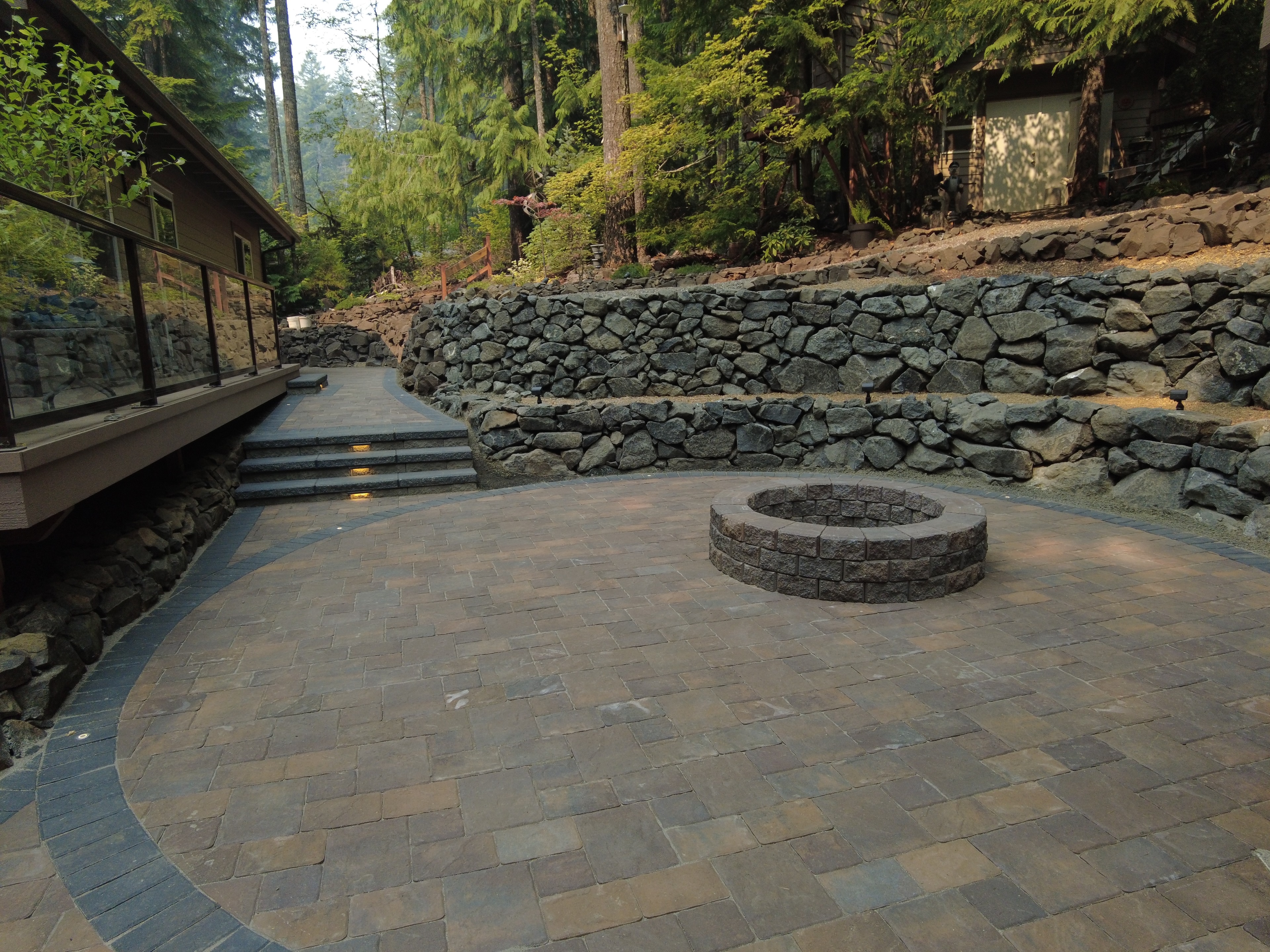Waterfront paver patio with lake views — residential hardscape project by Greenfields Landscape